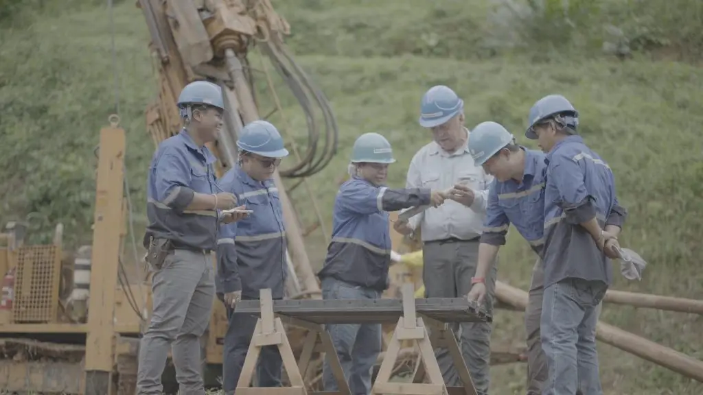 The ASX:FLG Geologist team on site examining freshly extracted drill core samples.